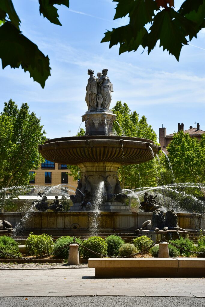10 Cool Things to Do in Aix-en-Provence Scenic view of the historic La Rotonde fountain in Aix-en-Provence, capturing its artistic beauty.